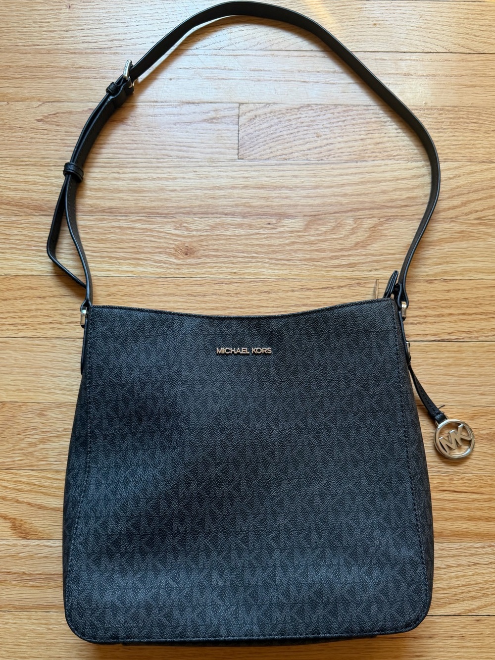 Michael Kors Jet Set Travel Messenger Bag in black signature monogram canvas